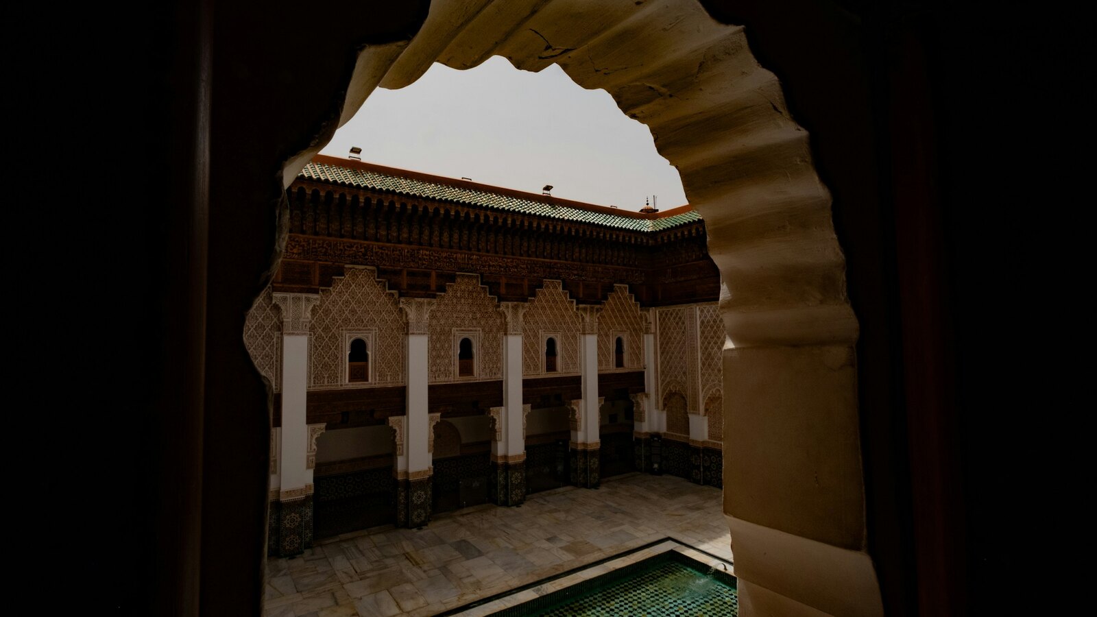 The courtyard of Riad Sable with orange trees and a plunge pool